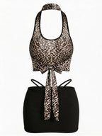 Velvet Fluxe Leo sheer leopard print halter neck bodysuit with cut-out details, luxury animal print intimate apparel.