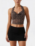 Velvet Fluxe Leo sheer leopard print halter neck bodysuit with cut-out details, luxury animal print intimate apparel.