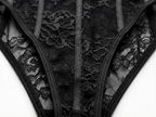 Close-up shot of black lace panties featuring sheer mesh fabric, intricate floral embroidery, and sleek black satin strapping. Detail of elegant women's intimates, high-cut lace underwear, and luxury bodysuit construction.