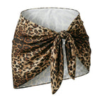 Velvet Fluxe Leo silk leopard print wrap mini skirt with side-tie knot, high-end animal print coordinate.