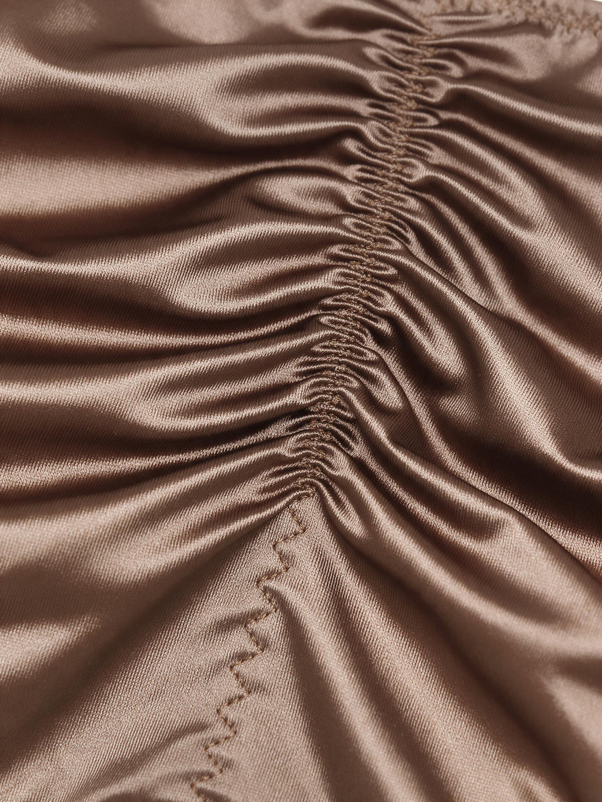Close-up fabric detail of Velvet Fluxe men's MIRAGE silky brown satin ruched brief, highlighting the cooling ice silk texture and engineered ruched center-back lifting seam.