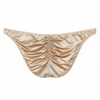 Flat lay back view of the men's champagne light luxury satin brief, detailing the ruched rear seam for natural sculpting and smooth, cooling high-stretch fabric.