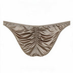 Flat lay back view of the men's silver light luxury satin brief, detailing the ruched rear seam for natural sculpting and smooth, cooling high-stretch fabric.
