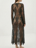 Velvet Fluxe Noir sheer floral lace maxi gown with leopard print silk lining and long sleeves, avant-garde evening wear.
