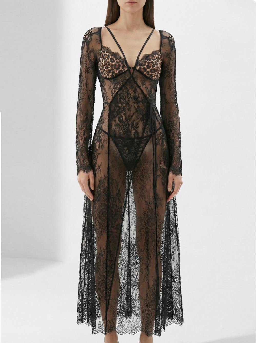 Velvet Fluxe Noir sheer floral lace maxi gown with leopard print silk lining and long sleeves, avant-garde evening wear.
