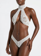 Velvet Fluxe Seraphina ivory eyelash lace lingerie set featuring a sliver body chain and choker neckline, perfect for bridal intimates.