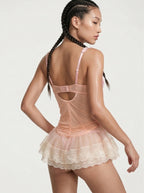 Velvet Fluxe Valerie blush pink sheer mesh slip dress featuring exposed corset boning and underwire cups, luxury romantic coquette lingerie.