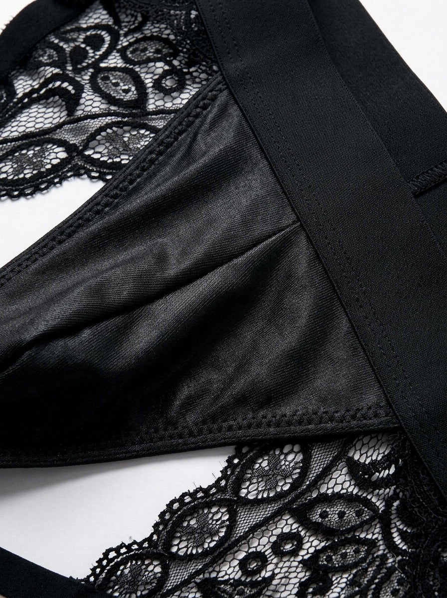 Close-up detail of Velvet Fluxe men's black sheer floral lace jockstrap, featuring breathable stretch lace panels and a solid elastic waistband.e