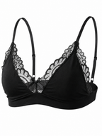 Velvet Fluxe NOCTURNE French men's black lace bralette. Product shot highlighting the sheer floral lace triangle cups, scalloped edging, center bow detail, and adjustable straps on a pure white background.