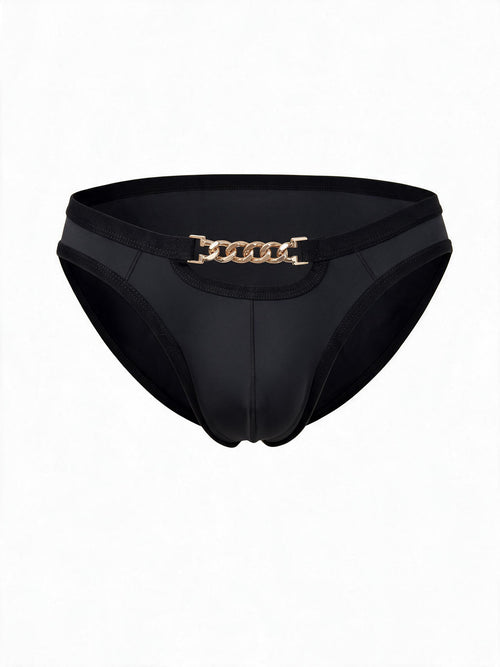 Flat lay product shot of AURELIUS black ice silk men's briefs, featuring a metallic gold chain waistband detail, front cutout, and premium nylon-spandex blend.
