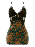 Front product view of the Gilded Emerald Devoré Velvet Slip Dress. Detailing the intricate black lace bust, sheer green base, and opulent gold floral velvet burnout fabric against a pure white background.